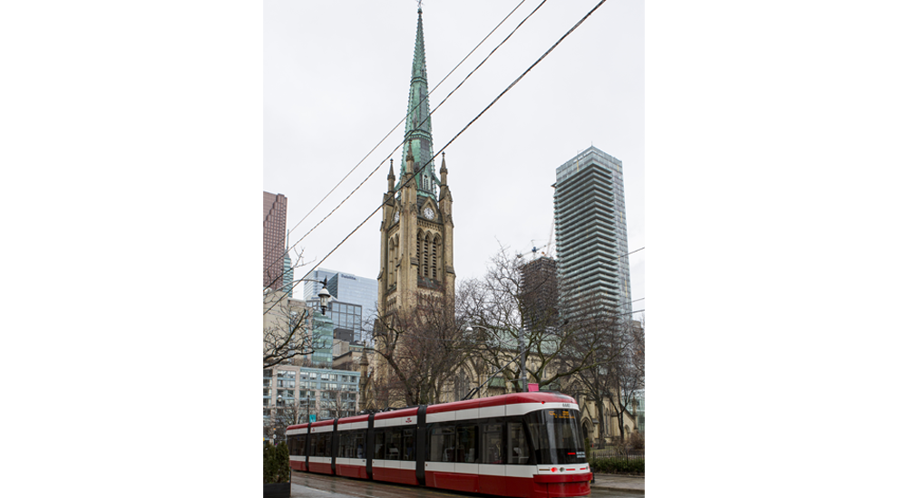 Cathedral Church of St James and a street car by St Lawrence Market